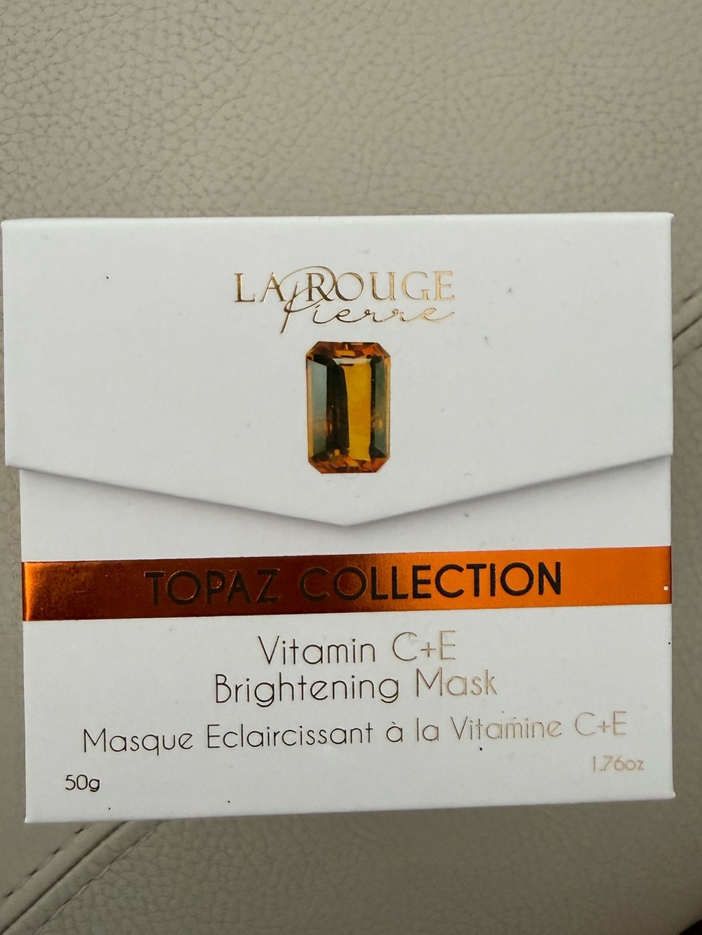 La rouge Topaz Collection Vitamin C+E Brightening Mask in gold and white